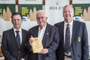 Peter Campbell receives his Meritorious Service Award from CYCA Commodore Howard Piggott and RYCT Commodore Graham Taplin